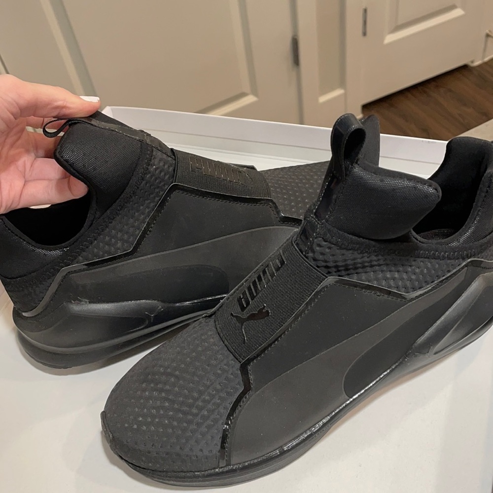 Black Puma Softride sneakers.